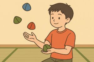 子どもが両手でお手玉を投げ合い練習する様子